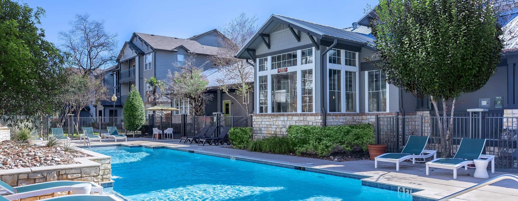a swimming pool in front of a building