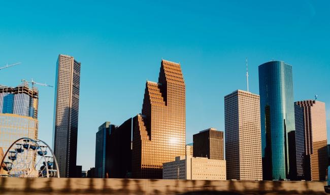 a city skyline with tall buildings