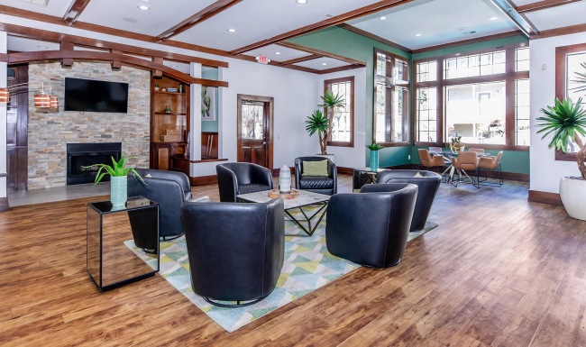 a spacious room with a fireplace